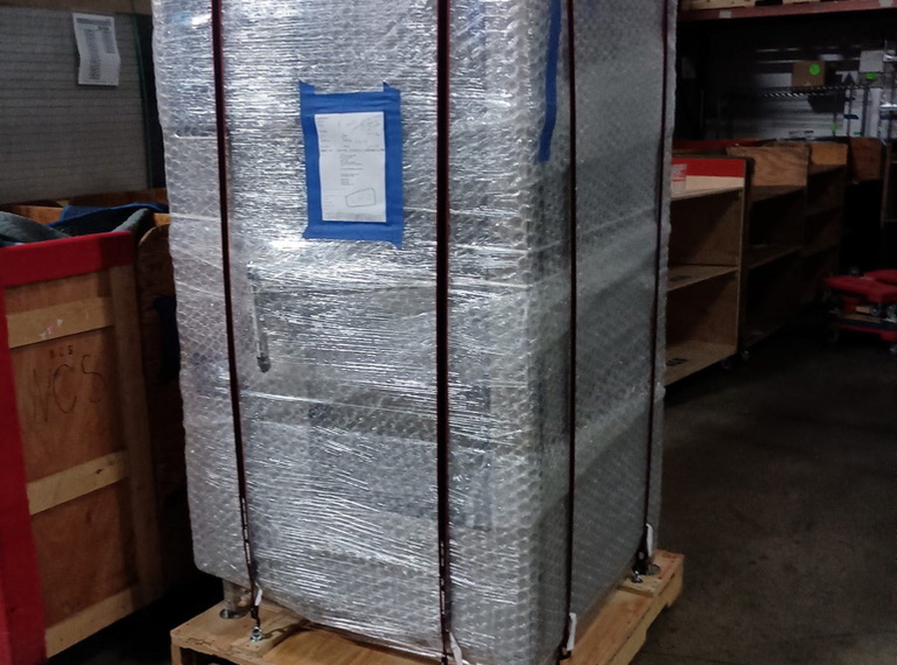 Palletized and wrapped shipment prepared by NCS for cross-country transport