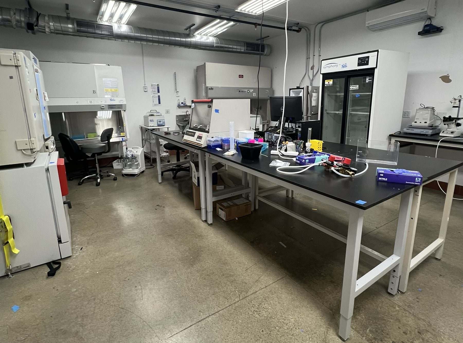 Laboratory bench and equipment staged during a lab relocation
