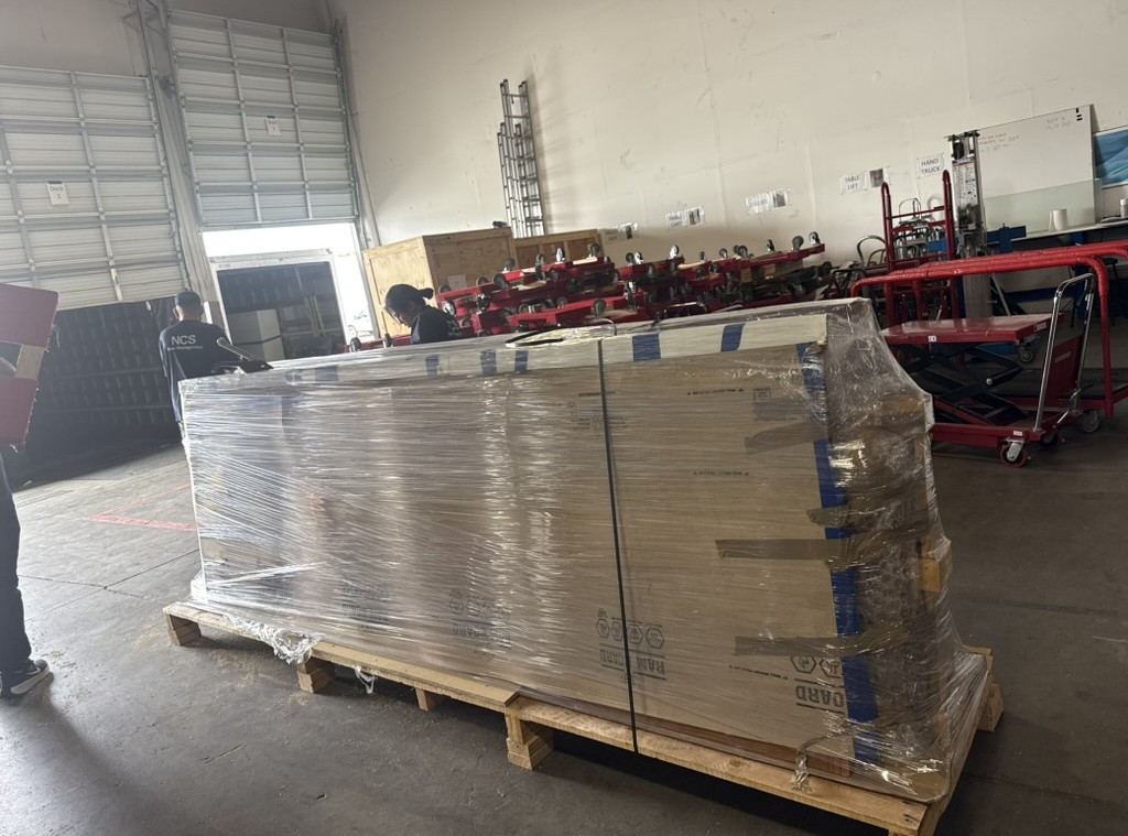 Palletized shipment shrink wrapped and staged at the NCS Oakland warehouse