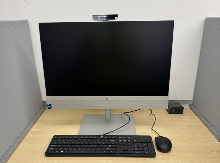 All-in-one workstation set in place at a reassembled desk